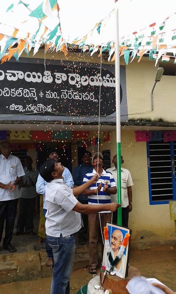 Community flag hoisting during an outreach visit